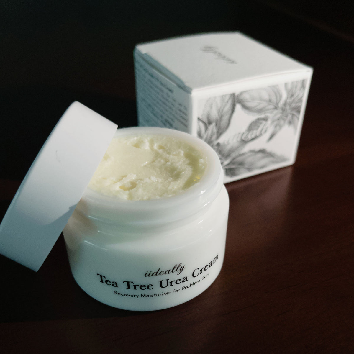 iideally Tea Tree Urea Cream for face, featuring a jar of soothing cream with tea tree and urea for skin repair and hydration